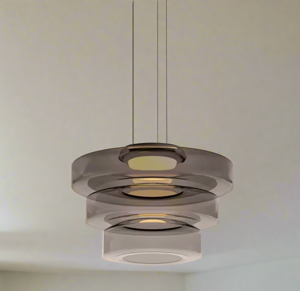 Luxury glass pendant light hanging above a modern kitchen island

